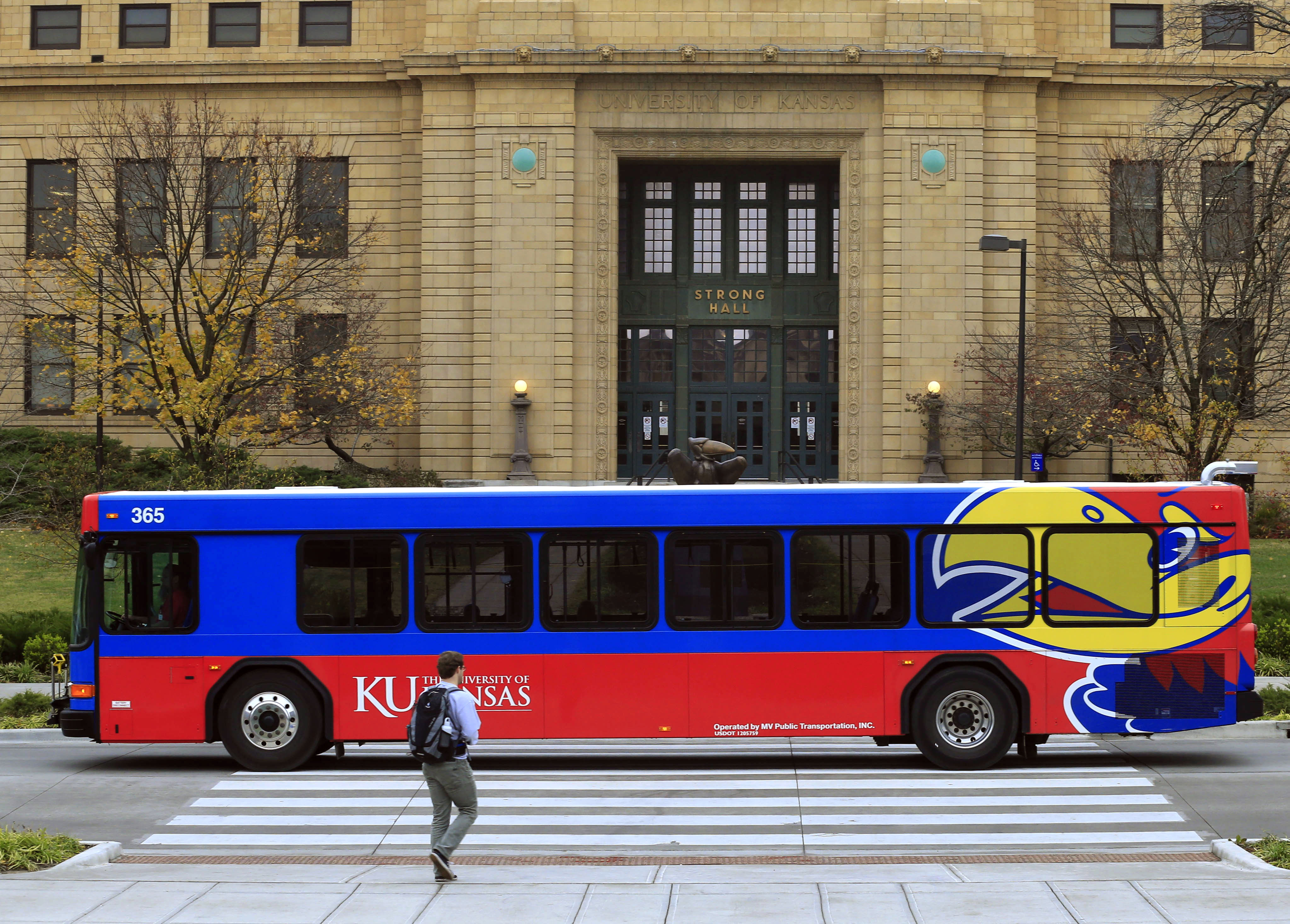 A bus passes in front of Strong Hall on Nov. 16, 2015, on the University of Kansas campus. (AP Photo/Orlin Wagner)